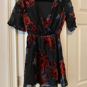 Short black dress with velvet floral